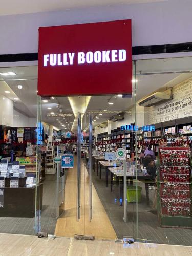 a fully booked sign in a grocery store at Elegant 2BR, 2 BA Suite Beside Eastwood Mall in Manila