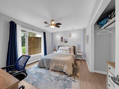 a bedroom with a bed and a window at Coastal Suite - Seacliff Beach Suites in Leamington