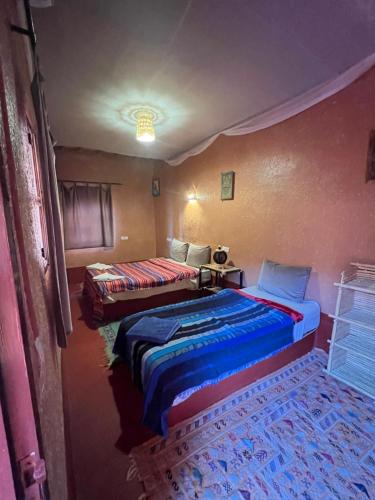 Ένα ή περισσότερα κρεβάτια σε δωμάτιο στο Auberge Ksar Ait Ben Haddou