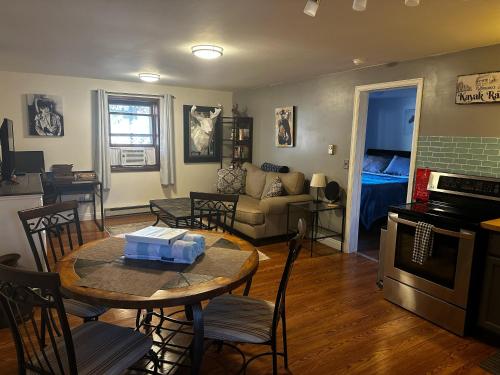 a kitchen and living room with a table and chairs at ATTACHED MOTHER-IN-LAW SUITE Soak in the hot tub, star gaze, enjoy the reservoir, hike, bike, kayak and more - Private floor, entrance, terrace and room and bathroom, not the full house in Fort Collins