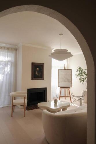 a living room with a couch and a table at Mr. Nomad: Casa Bohem in Uptown in Dallas