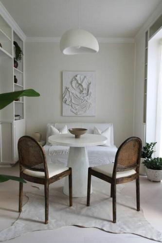 a living room with two chairs and a table at Mr. Nomad: Casa Bohem in Uptown in Dallas