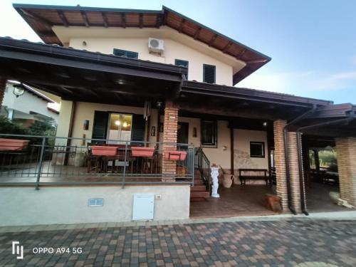 a house with a patio and a deck at La Dimora di Angela in Amendolara