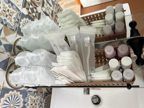 a shelf filled with white products on a table at คีรีศิลป์ รีสอร์ท เชียงราย (Khirisin Resort Chiang rai) in Ban Nong Salaep