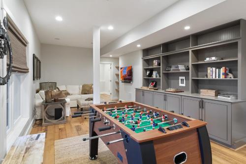 a living room with a foosball table at 4 Pines in Boone