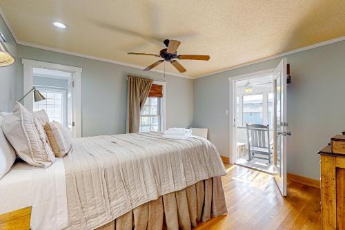 a bedroom with a bed and a ceiling fan at The Answer in Edisto Island