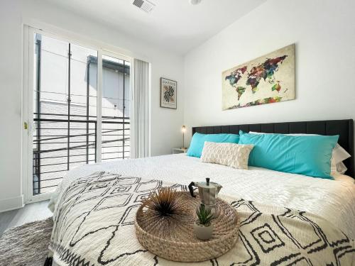 a bedroom with a large bed with a large window at Mary's Stay H St Corridor in Washington, D.C.