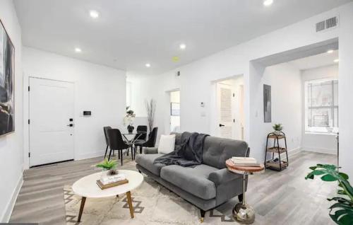 a living room with a couch and a table at Mary's Stay H St Corridor in Washington, D.C.