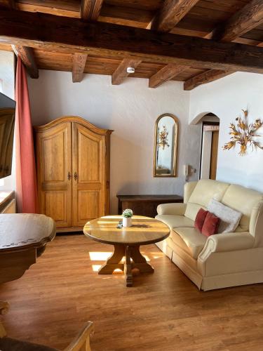 a living room with a couch and a table at Apartmenthaus Eurenerstrasse 179 in Trier