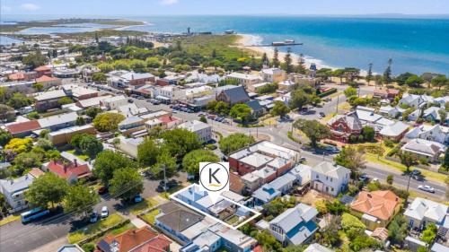 an aerial view of a small town next to the ocean at Coastal Cottage in Queenscliff