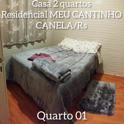a bed in a room with at RESIDENCIAL MEU CANTINHO in Canela