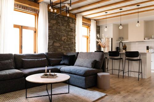 a living room with a couch and a table at Maison Place Royale by Luxury In Transit in Montréal