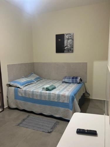 a small bedroom with a bed in a room at Hotel Pousada Barra Bonita in Barra Bonita