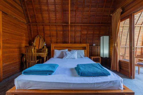 Postel nebo postele na pokoji v ubytování Kubu Selat Villa and Glamping