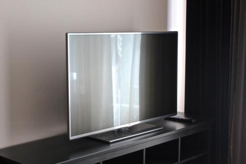 En TV eller et underholdningssystem på Moravia Boutique Apartments