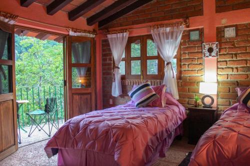 Katil atau katil-katil dalam bilik di Casa La Potranca