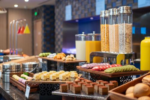 a buffet with different types of food and drinks at Holiday Inn Express Beijing Downtown, an IHG Hotel in Beijing