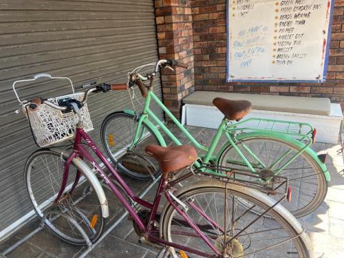 two bikes parked next to each other on a sidewalk at Conjola Inn-let - Self Contained Unit - Lake Conjola in Manyana