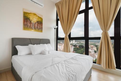 a bedroom with a large bed and a large window at Medic Homestay Selayang Residence 280 in Batu Caves