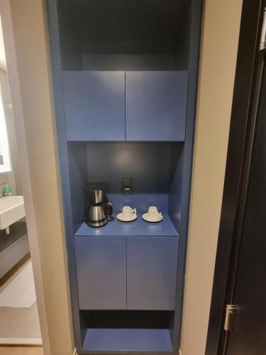 Kuchyň nebo kuchyňský kout v ubytování AlphaStay by Alpha - StayService
