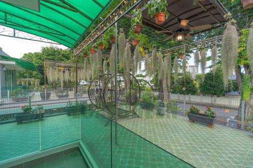 a pool of water with plants in a building at LuxegreenRetreat , Bungalow - Georgetown, Penang in George Town