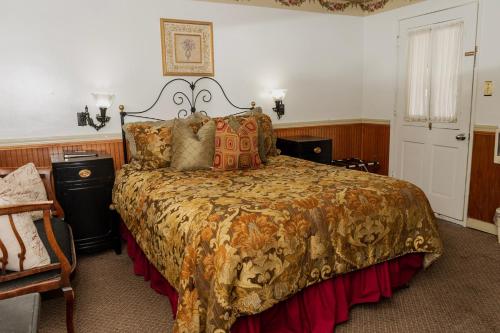 Ένα ή περισσότερα κρεβάτια σε δωμάτιο στο Gunn House Hotel