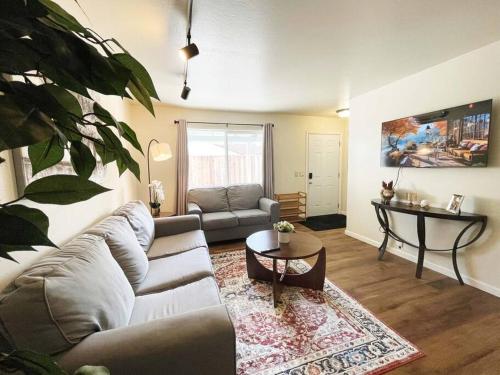 a living room with a couch and a table at 434-Campbell Cozy & Bright 2B/1b /AC/close to Downtown in Campbell