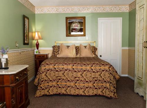Ένα ή περισσότερα κρεβάτια σε δωμάτιο στο Gunn House Hotel