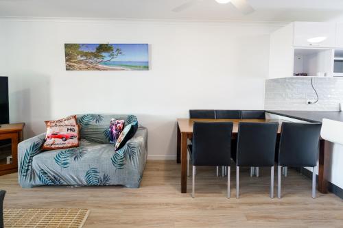 a living room with a couch and a table at Growder Court 3 - Coolum Beach QLD in Coolum Beach