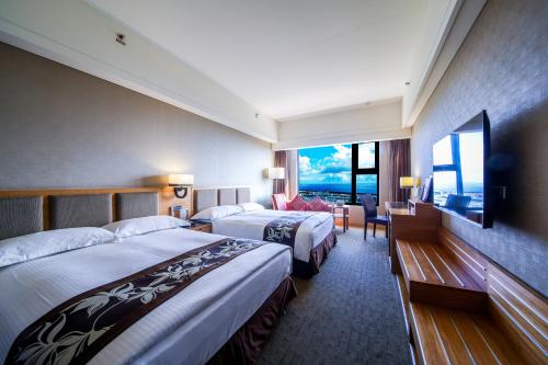 Postel nebo postele na pokoji v ubytování Fullon Hotel Hualien