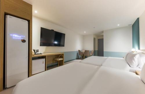 Una cama o camas en una habitación de Hotel Aria