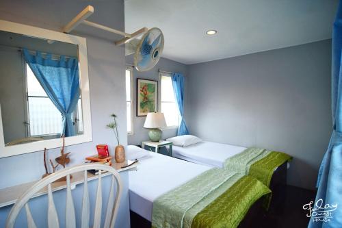 Postel nebo postele na pokoji v ubytování Fulay Guesthouse Hua Hin