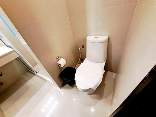 a small bathroom with a toilet and a roll of toilet paper at 7B-Short-term rental allowed-5BRs Downtown Bangkok in Makkasan