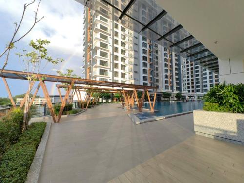 a large building with a bridge over a walkway at Near Airport K Avenue Family Room in Donggongon