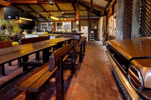 a row of wooden benches in a restaurant at BIG4 Casino Holiday Park in Casino