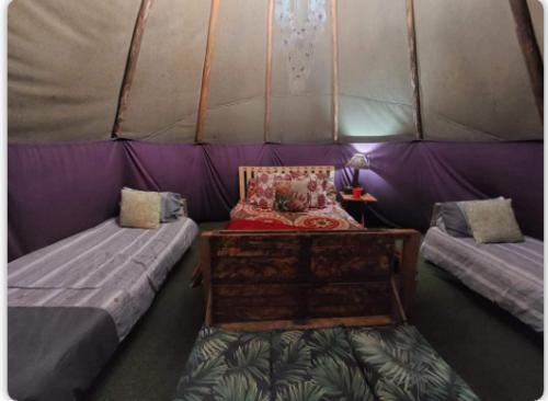 a room with two beds in a tent at Gibaland in Pinetown