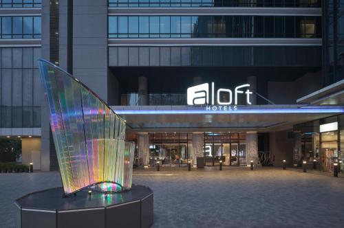 a glass sculpture in front of a building at Aloft Singapore Novena in Singapore