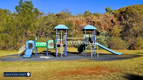 a playground with two slides and a slide at Minnamurra Villa on the River in Minnamurra