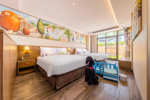 a dog sitting on a chair in a hotel room at Grand Cosmos Resort Ruisui Hualien in Ruisui