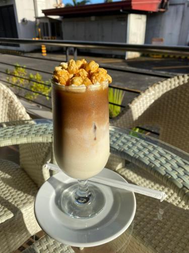a drink sitting on a table with peanuts in it at La Piazza Hotel and Convention Center Inc. in Legazpi