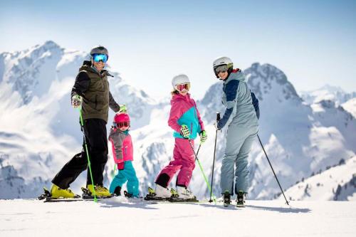 a group of people on skis on a mountain at Topp Rossmoos in Alpbach