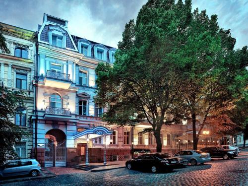 a group of cars parked in front of a building at Continental Hotel in Odesa