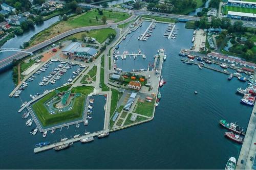 an aerial view of a marina with boats in the water at Comfortable holiday home on a private property Kolobrzeg in Kołobrzeg