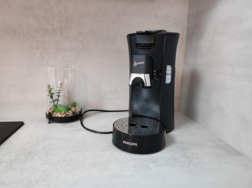 a coffee maker is sitting on a counter at Le LUX 31 in Thionville