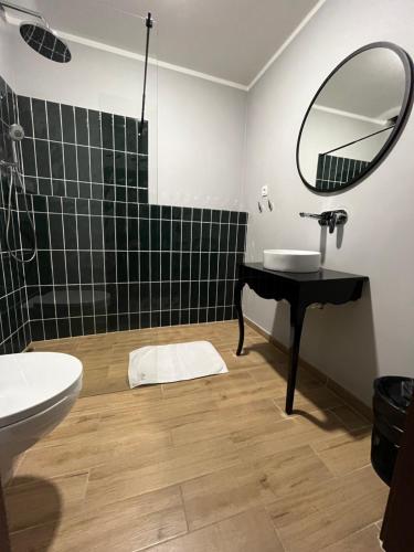 a bathroom with a sink and a mirror at Cosy Apartments Deluxe in Krakow