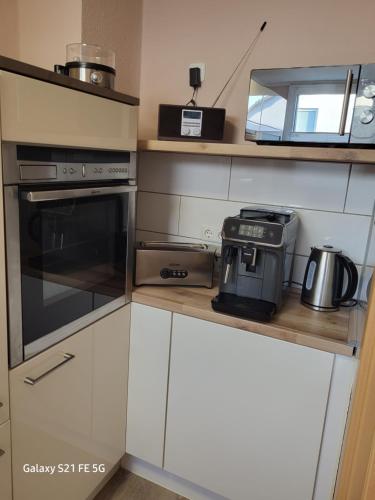 a kitchen with a stove and a toaster oven at Apartment Bochum in Bochum