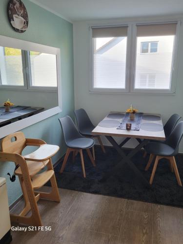 a dining room with a table and two chairs at Apartment Bochum in Bochum