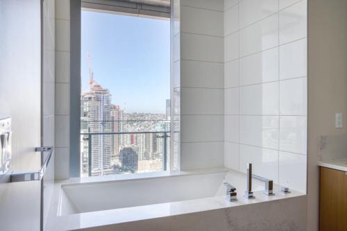 a bathroom with a bath tub and a window at Downtown 2BR w Gym WD BBQ nr Dining Shops SEA-634 in Seattle