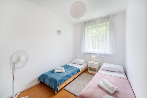 Vuode tai vuoteita majoituspaikassa Baltica Maczka 2-Bedroom Apartment