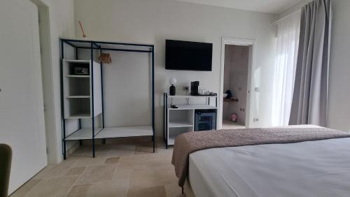 Katil atau katil-katil dalam bilik di Suites Dimora Garibaldi